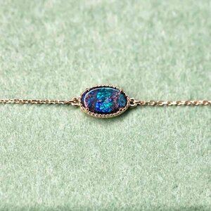 Oval Shaped Australian Boulder Opal Bracelet in 18K Yellow Gold
